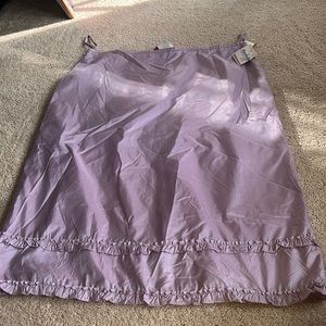 Lilac skirt with ruffle detail at the bottom